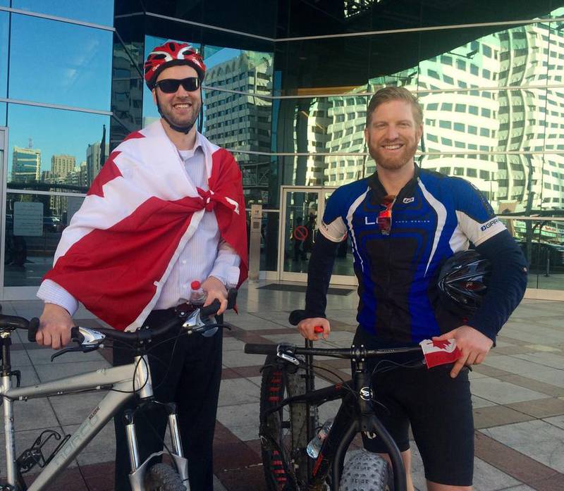 Mark Graham and Marc Lorrain, both from the Canadian Embassy of Abu Dhabi arrive at the office after cycling to work. Mona Al Marzooqi / The National
