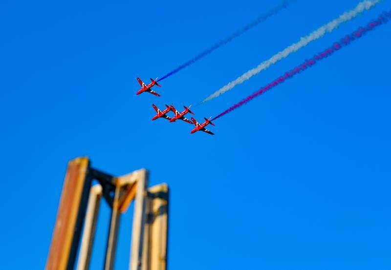 The Red Arrows perform aerial manoeuvres above the skies of Kuwait City. EPA