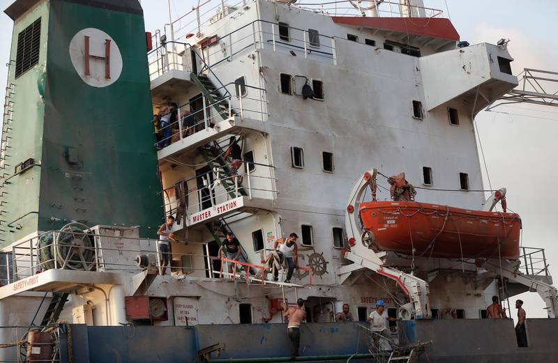 Sailors leave their damaged ship near the explosion in Beirut. AP Photo