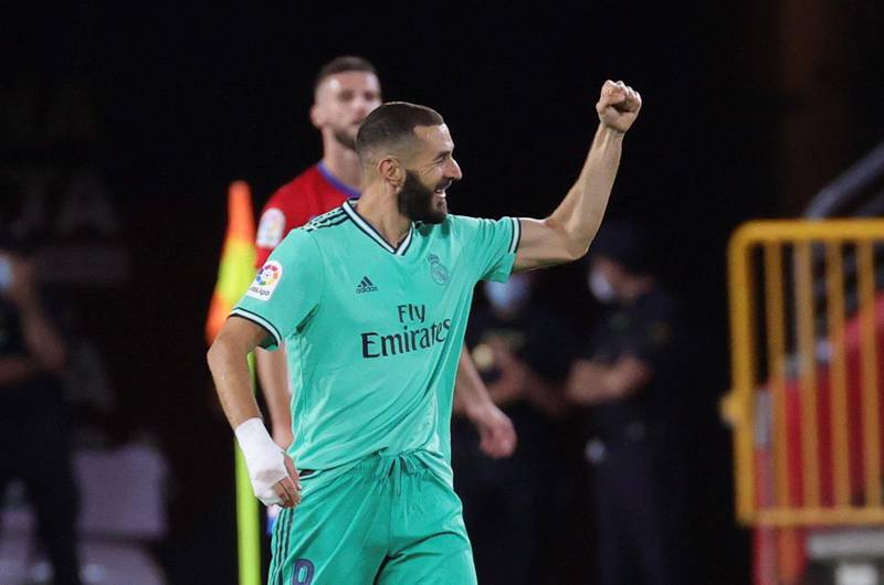 Karim Benzema celebrates after scoring Real Madrid's second goal against Granada. EPA