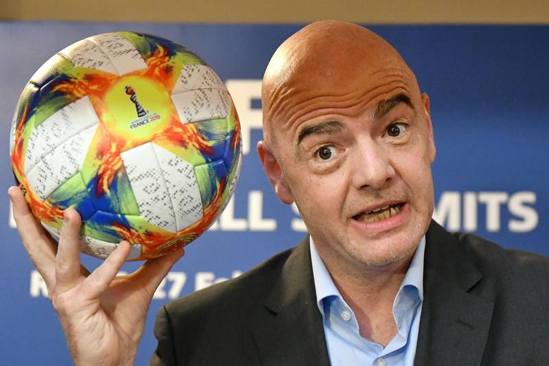 (FILES) In this file photo taken on February 27, 2019 FIFA President Gianni Infantino poses with the official ball of the 2019 Women's World Cup during a press conference at the end of the FIFA Executive Football Summit in Rome. An expanded 48-team World Cup in 2022 would deliver a financial windfall of up to $400 million according to an internal feasibility study commissioned by FIFA, a source with knowledge of the document told AFP on March 12, 2019. The ruling council of football's global governing body meets in Miami this week with the issue of the 2022 World Cup format in Qatar expected to dominate discussions.FIFA President Gianni Infantino is a notable supporter of increasing the size of the tournament from 32 teams to 48 teams, accelerating an expansion which was first due to take place at the 2026 tournament.
 / AFP / Alberto PIZZOLI
