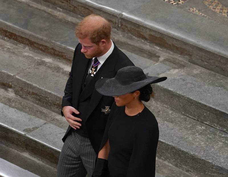 For most events surrounding the funeral, Prince Harry was in civilian garb rather than military uniforms. Getty Images