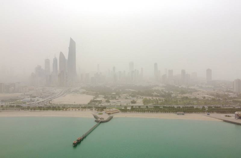 An aerial view shows Kuwait City during a dust storm. AFP