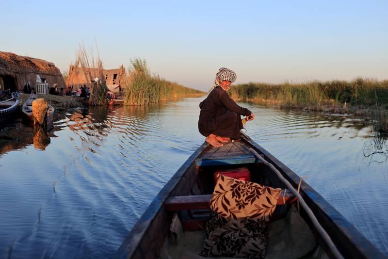 A man paddles his boat at the Chebayesh marsh, Dhi Qar province, Iraq, August 13. Reuters