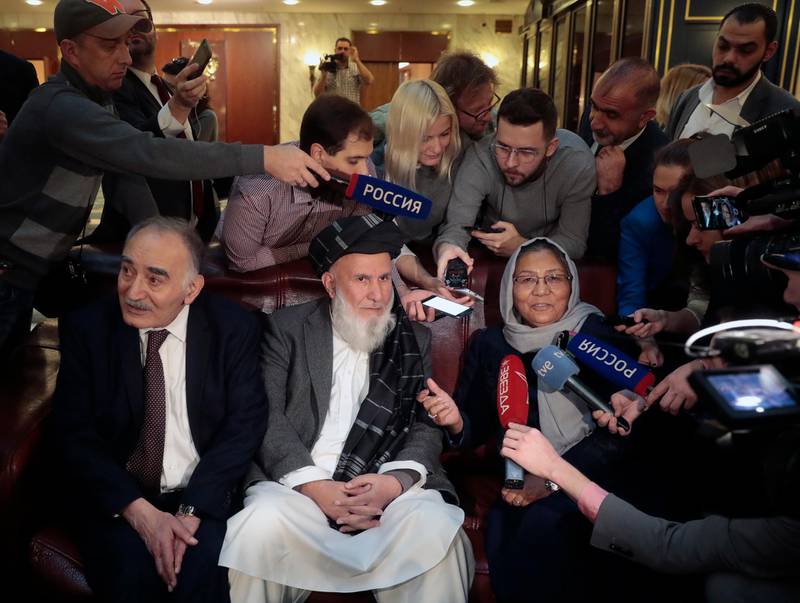 Representatives of the Afghan High Peace Council speak to journalists before the talks. EPA