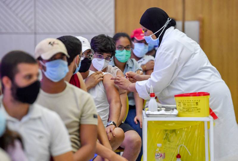 A Tunisian youth receives a dose of the Sinopharm vaccine at the Palais des Congres in Tunis. Last week, a plane carrying 500,000 Covid-19 vaccine doses, donated by the UAE to help curb the spread of the virus, arrived in Tunisia.