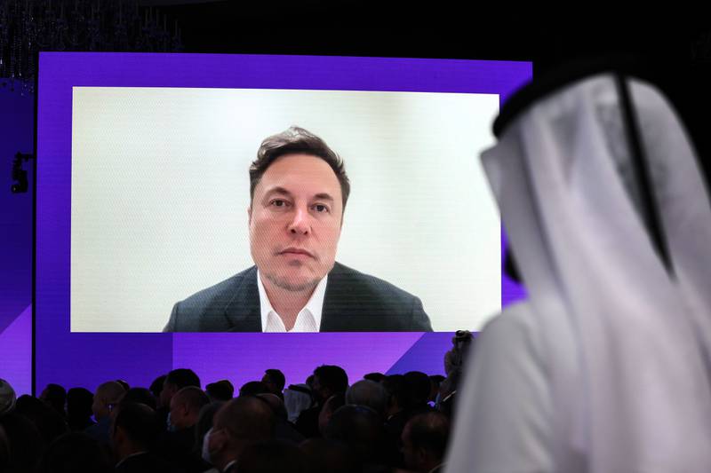 Elon Musk, chief executive of Tesla, appears via video link at the Qatar Economic Forum in Doha. Bloomberg