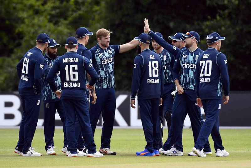 England's David Willey celebrates with teammates after taking the wicket of Netherland's Vikramjit Singh. Reuters