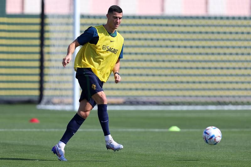 Cristiano Ronaldo of Portugal passes the ball during a training session at Al Shahaniya SC on November 21, 2022 in Doha, Qatar. Getty Images