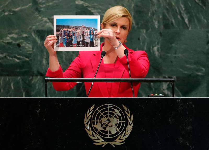 Croatia's President Kolinda Grabar-Kitarovic holds up a photograph as she addresses the 74th session of the United Nations General Assembly. Reuters