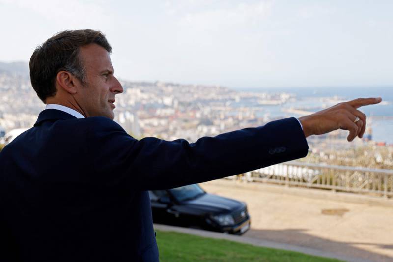 Mr Macron at a viewpoint overlooking the Bay of Algiers during his visit to the Martyrs Monument. AFP