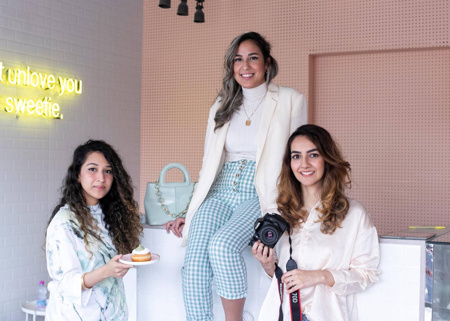 DUBAI, UNITED ARAB EMIRATES. 16 FEBRUARY 2020. Samah Khan, Graphic Designer; Sara Chouki, Social Media Manager; and Nabeela Ismail, Content Creator; at Threelancers, in their clients store: Lena Lu.(Photo: Reem Mohammed/The National)Reporter:Section:
