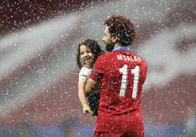 Mohamed Salah celebrates with his daughter after winning the Champions League Final. Reuters