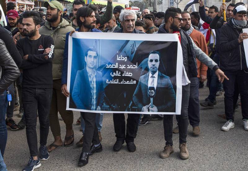 Iraqis take part in a rally on January 11, 2020, to mourn two reporters shot dead the previous evening in the country's southern city of Basra. AFP