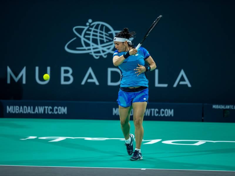 Ons Jabeur hits a shot to Belinda Bencic at the Mubadala World Tennis Championship. Victor Besa / The National