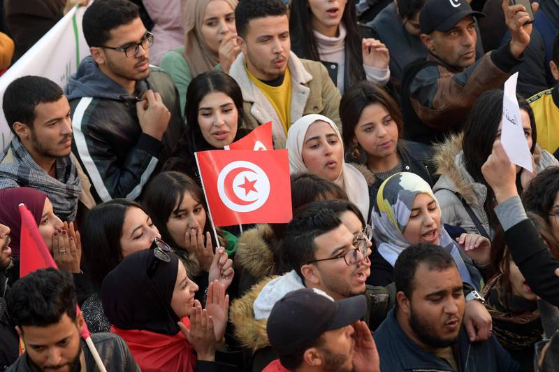 Tunisians take part in a rally marking the ninth anniversary of the 2011 uprising, at Habib Bourguiba Avenue in Tunis on January 14, 2020.  AFP