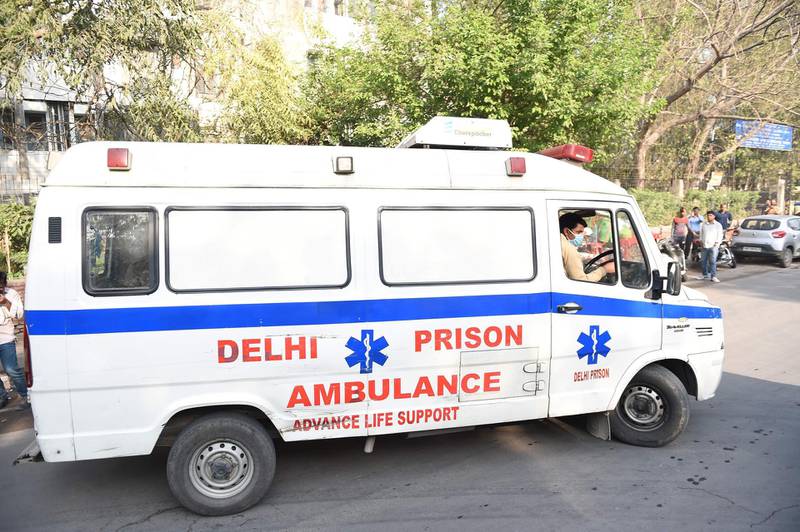 An ambulance carrying the bodies of four executed men enters Deen Dayal Upadhyay hospital in New Delhi. AFP