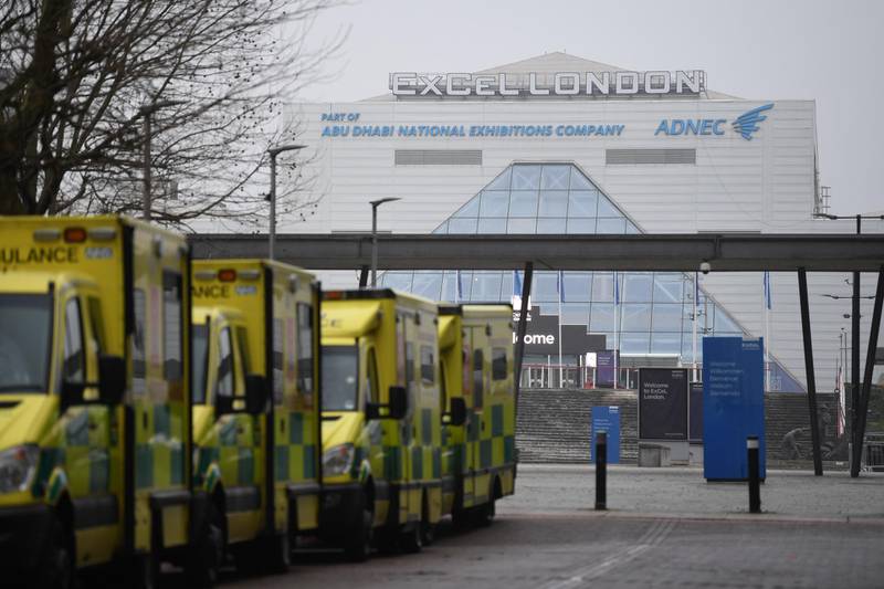 Ambulances are parked outside the NHS Nightingale hospital at the Excel centre in east London on January 1, 2021. London's Nightingale Hospital is ready to admit patients as hospitals in the capital struggle, the NHS has said. / AFP / DANIEL LEAL-OLIVAS
