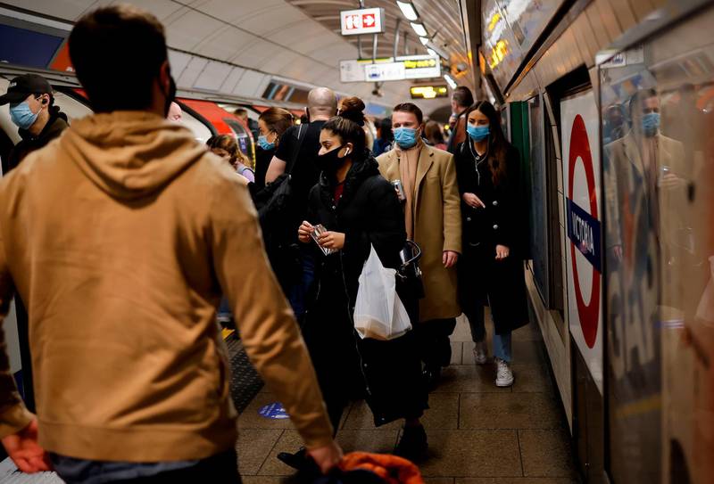 Passengers travel via a London Underground tube train during the morning rush hour. AFP
