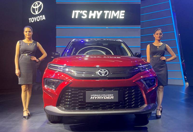 Models pose at the unveiling of Toyota's new hybrid SUV Urban Cruiser Hyryder in New Delhi, India. Reuters