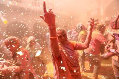 The festival heralds the arrival of spring and, for many Hindus, the triumph of good over evil. EPA
