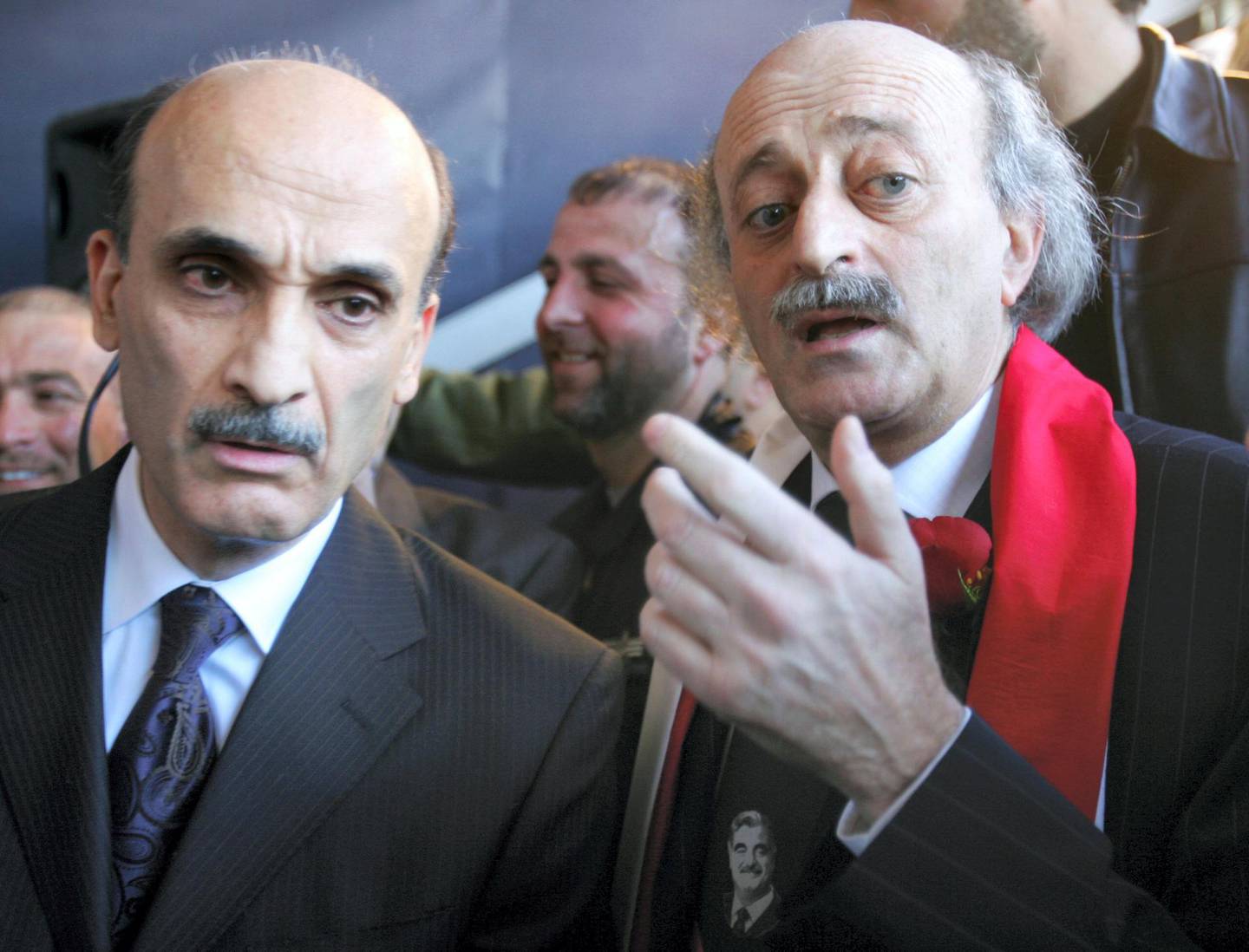Lebaenese MP and Druze leader Walid Jumblatt (R) and Samir Geagea, the leader of the Christian Lebanese Forces ex-militia, attend a mass gathering to mark the first anniversary of premier Rafiq Hariri's assassination in central Beirut 14 February 2006. Speaking at the mass rally, Jumblatt went a step further to brand Syrian President Bashar al-Assad a "terrorist tyrant". The Lebanese capital was transformed into a sea of red and white flags as Lebanon marked the first anniversary, still struggling to unite in the shadow of its former powerbroker Syria.  AFP PHOTO/RAMZI HAIDAR (Photo by RAMZI HAIDAR / AFP)