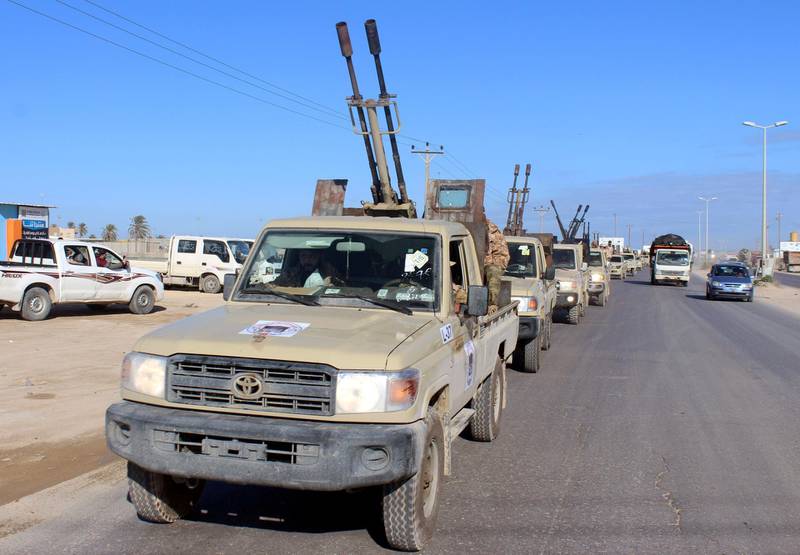 FILE PHOTO: Military vehicles of the Libyan internationally recognised government forces head out to the front line from Misrata, Libya February 3, 2020. REUTERS/Ayman Al-Sahili/File Photo
