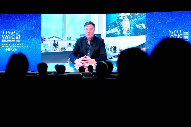 Tesla Inc Chief Executive Officer Elon Musk is seen on a screen during a video message at the opening ceremony of the World Artificial Intelligence Conference (WAIC) in Shanghai, China July 9, 2020. REUTERS/Aly Song
