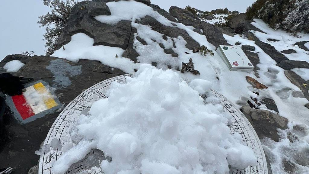 Residents marvel at Oman's snow-covered mountain