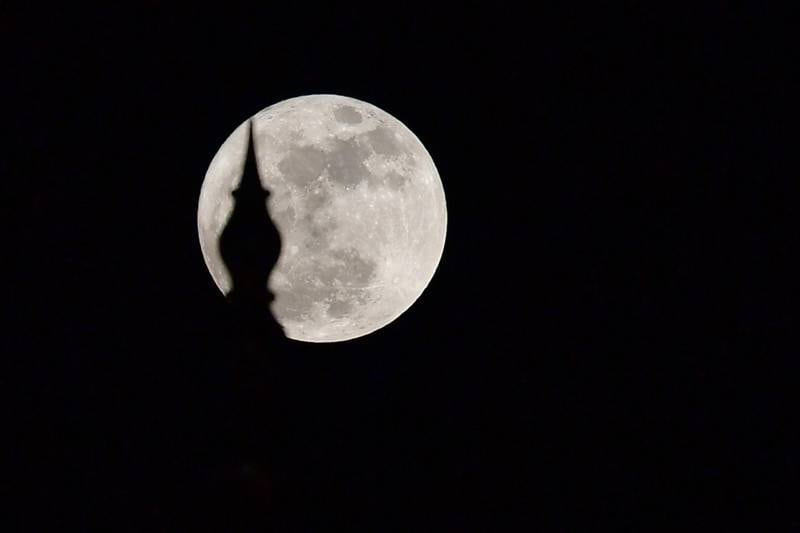 The "supermoon" rises over the Sheikh Zayed Grand Mosque in Abu Dhabi. Guiseppe Cacace / AFP