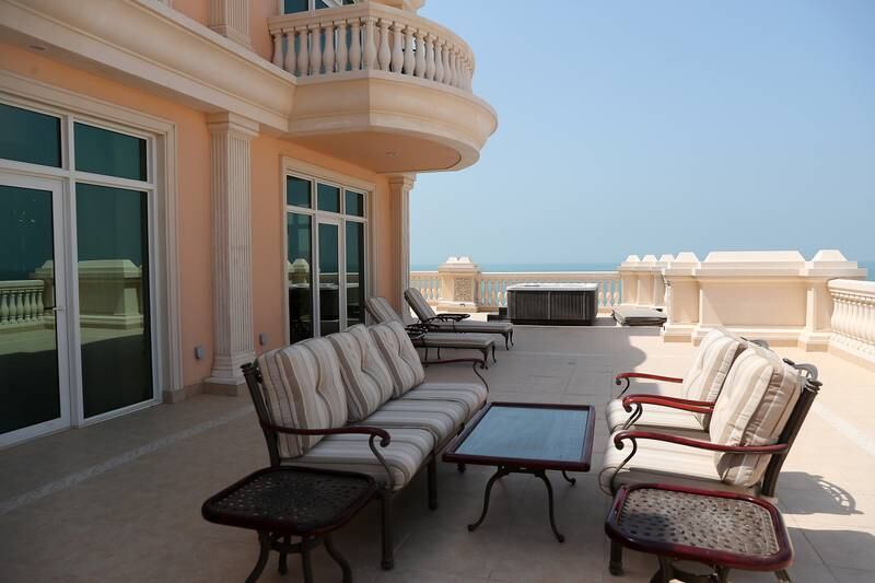 A private deck in the Premium Club Terrace room at Raffles The Palm Dubai