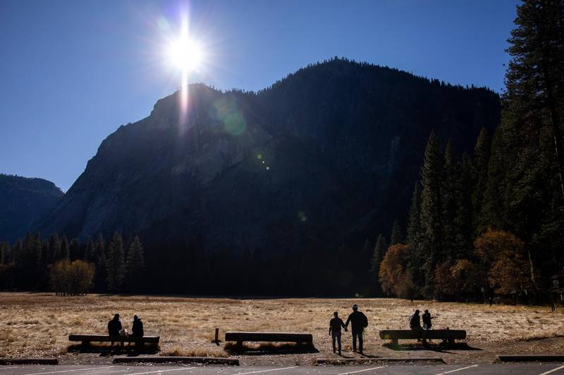 Social distancing couples, enjoy the weather at the Ahwahnee Meadow on Thanksgiving day at Yosemite Valley National Park in Yosemite Valley, California, USA.  EPA