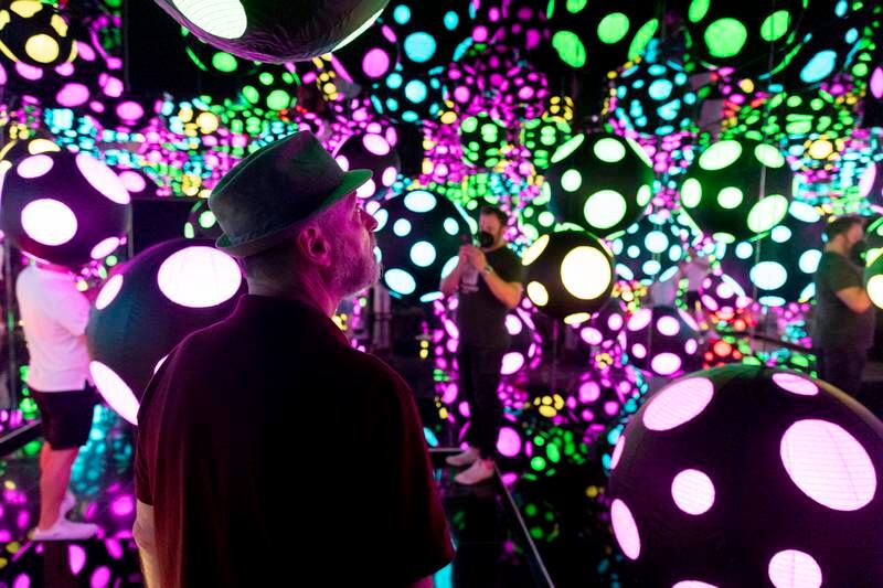 Visitors enter an infinity mirror room entitled 'My Heart is Dancing into the Universe', part of the exhibition One with Eternity, featuring the work of Yayoi Kusama, at the Hirshhorn Museum in Washington, DC. EPA