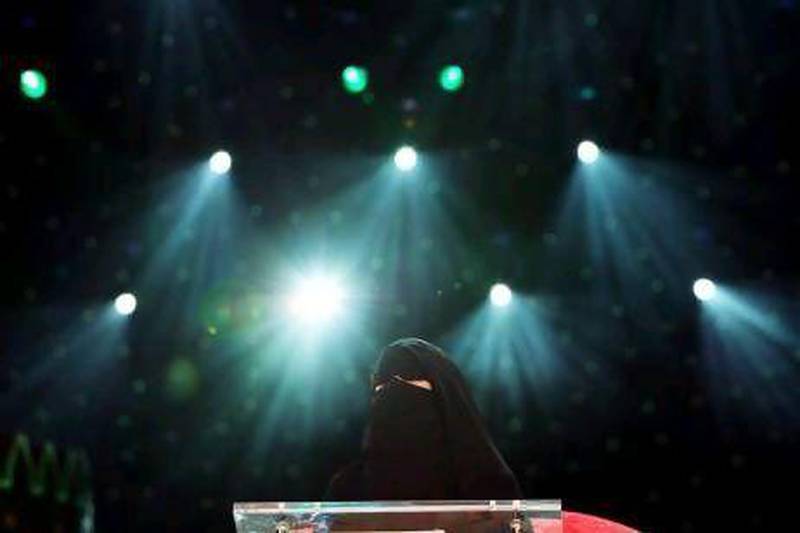 Poetess Hissa Hilal from Saudi Arabia, on stage during the 2010 Million's Poet competition in Abu Dhabi. Ali Haider / EPA
