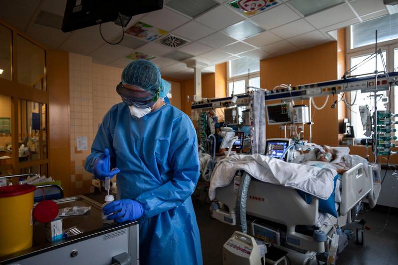 A medical professional wearing protective gear prepares drugs for a patient infected with coronavirus (COVID-19) in the intensive care unit of the General University Hospital in Prague, Czech Republic. Getty Images