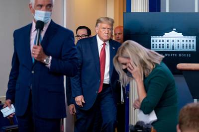 President Donald Trump returns to a news conference in the James Brady Press Briefing Room after he briefly left because of a security incident outside the fence of the White House. AP Photo