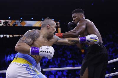 Oleksandr Usyk in action against Anthony Joshua. Action Images