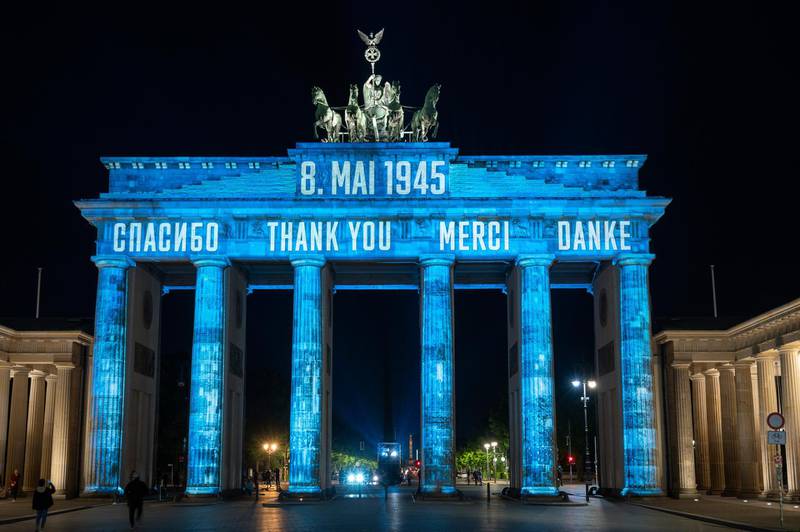 In Russian, from left, English, French and German, the Brandenburg Gate is illuminated with the word "Thank you," in Berlin, Germany. May 8th marked the 75th anniversary of the end of World War II in Europe. AP