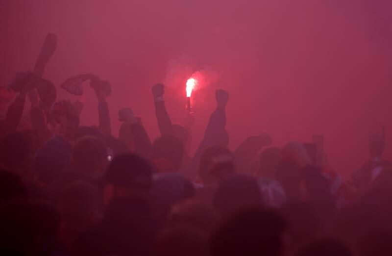 Liverpool fans with flares outside the stadium. Reuters