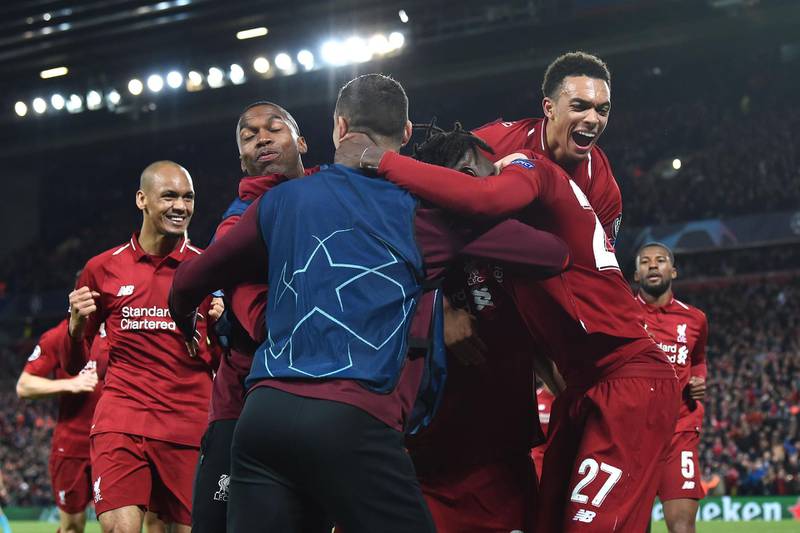 The Liverpool celebrate after scoring their fourth goal during the UEFA Champions league semi-final second leg football match between Liverpool and Barcelona at Anfield in Liverpool, north west England on May 7, 2019.  / AFP / Paul ELLIS                       

