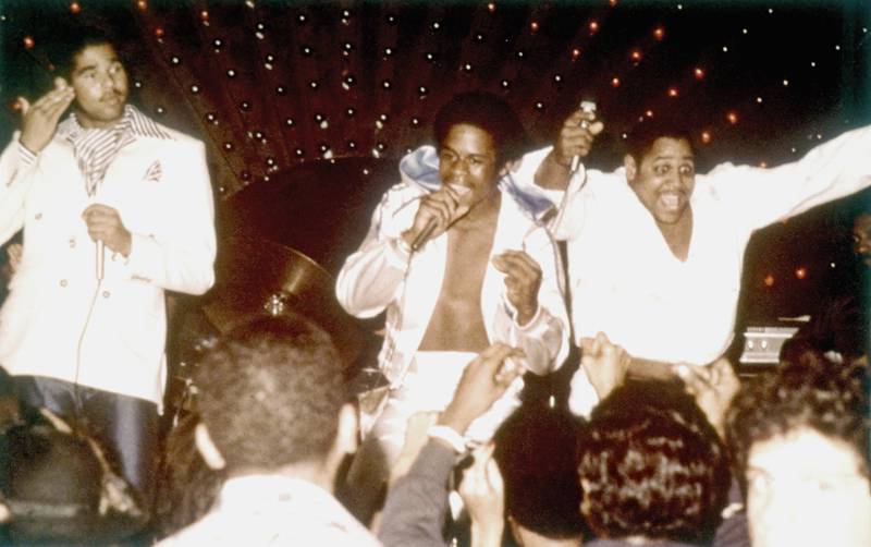 The Sugarhill Gang, from left, Wonder Mike, Master Gee and Big Bank on stage in the late 1970s in New York. Getty Images