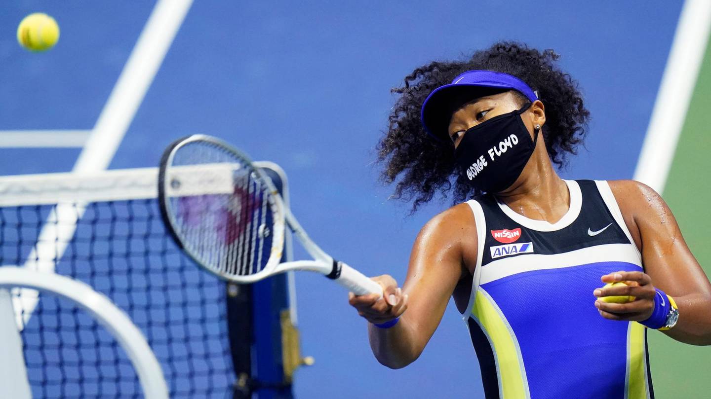 Naomi Osaka, of Japan, fires a ball into the stands after defeating Shelby Rogers, of the United States, during the quarterfinal round of the US Open tennis championships, Tuesday, Sept. 8, 2020, in New York. (AP Photo/Frank Franklin II)