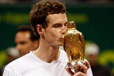 Britain's Andy Murray holds the trophy after winning the final of the ATP Qatar tennis open against Andy Roddick from the U.S. in Doha, Qatar, Saturday, Jan. 10, 2009. (AP Photo/Hassan Ammar) *** Local Caption ***  HAS108_Qatar_ATP_Qatar_Open_Tennis.jpg