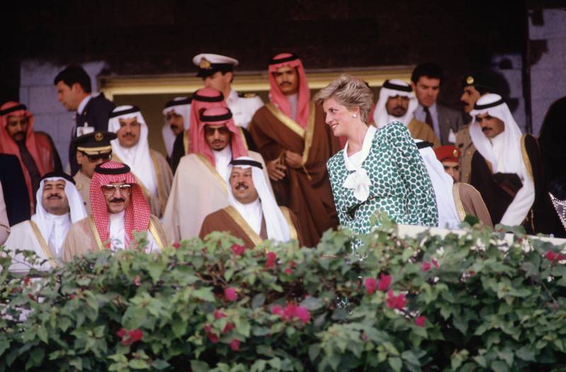 Diana, Princess of Wales, watches camel racing in Dubai in March 1989, during a tour of the Gulf states with her husband, the heir to the British throne Prince Charles. Getty