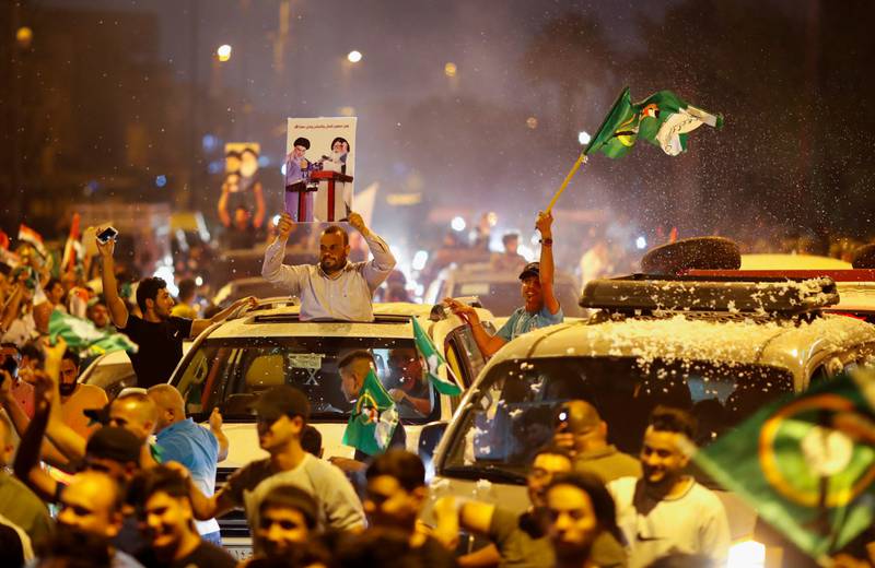 Supporters of Shiite cleric Moqtada Al Sadr celebrate after preliminary results were announced. Reuters