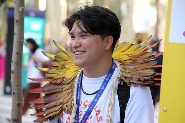 A delegate arrives for the first day of Cop28. Cop28. Pawan Singh / The National