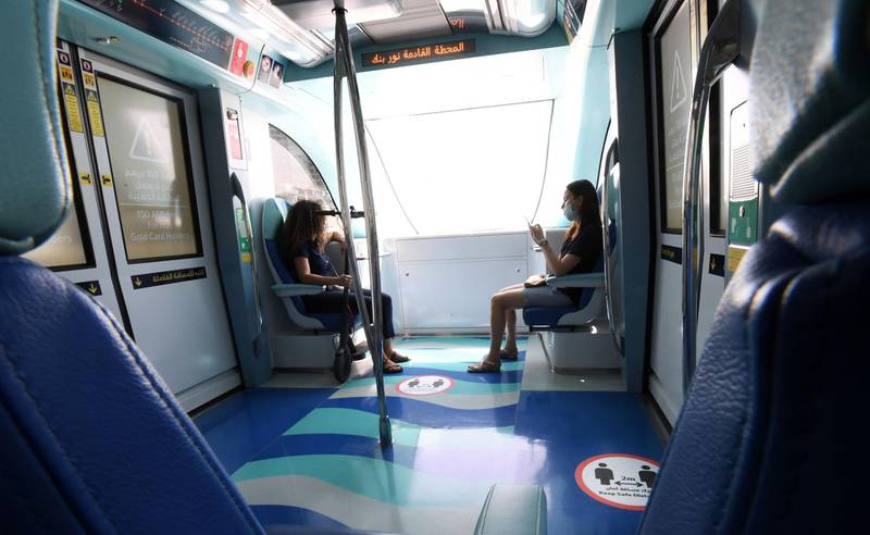 Dubai Metro passengers keep a safe distance. AFP