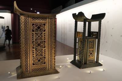 The 19th century throne of King Ghezo, left, and the throne of King Glele, from Benin, are part of the exhibit. AP