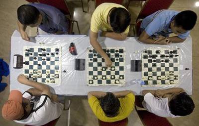 Players study their next move during the Filipino Chess Players League tournament in Reef Mall in Deira.