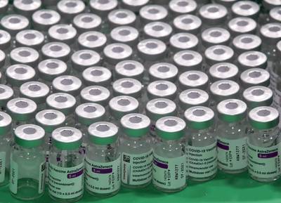 Empty vials of Oxford/AstraZeneca's COVID-19 vaccine are seen at a vaccination centre in Antwerp, Belgium March 18, 2021. REUTERS/Yves Herman